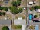 Aerial top-down view of a home with a spacious backyard, patio, and mature trees at 2833 Beal St, Deltona, FL 32738