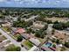 Wide aerial view of a neighborhood showcasing tree-lined streets and diverse home styles at 2833 Beal St, Deltona, FL 32738
