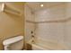 Bright bathroom featuring a tiled bathtub with shower combo and updated fixtures at 2833 Beal St, Deltona, FL 32738