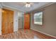 Bedroom with wood-look floors and a window that provides natural light at 2833 Beal St, Deltona, FL 32738