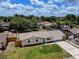 Lovely exterior view of a single story home featuring a well manicured lawn and cozy facade with inviting blue door at 2833 Beal St, Deltona, FL 32738