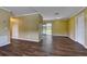 The bright living room features hardwood-style floors and a sliding glass door leading to the backyard at 2833 Beal St, Deltona, FL 32738