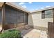 Back patio with brick steps leading up to the screened in porch at 2921 Wekiva Rd, Tavares, FL 32778