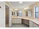 Bathroom showcasing dual sinks, a spacious vanity, and separate shower area at 2921 Wekiva Rd, Tavares, FL 32778