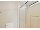 Functional bathroom featuring a toilet, and a sliding glass door shower at 2921 Wekiva Rd, Tavares, FL 32778