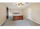 Spacious bedroom with a ceiling fan, complemented by neutral walls at 2921 Wekiva Rd, Tavares, FL 32778