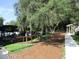 Picturesque view of the boat dock area surrounded by lush trees and green space at 2921 Wekiva Rd, Tavares, FL 32778