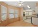 Dining area featuring wainscotting and many windows at 2921 Wekiva Rd, Tavares, FL 32778