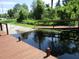 View from a wooden dock with canal and neighborhood access at 2921 Wekiva Rd, Tavares, FL 32778