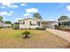 Charming single-story home featuring a covered carport and well-maintained landscaping at 2921 Wekiva Rd, Tavares, FL 32778