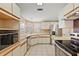 Open kitchen featuring stainless steel appliances, tiled floors, and laminate countertops at 2921 Wekiva Rd, Tavares, FL 32778