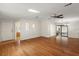 Spacious living room has an open floor plan with hardwood floors and lots of natural light at 2921 Wekiva Rd, Tavares, FL 32778