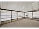 Spacious enclosed sunroom with carpet and lots of natural light at 2921 Wekiva Rd, Tavares, FL 32778