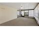 Enclosed sunroom with carpet flooring and sliding glass door at 2921 Wekiva Rd, Tavares, FL 32778