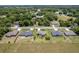 An aerial view of the house set among other homes and manicured lawns at 30 Olive Cir, Ocala, FL 34472