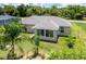 A partial aerial view of the rear of the house showcasing the lush backyard at 30 Olive Cir, Ocala, FL 34472