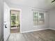 Inviting living area featuring modern flooring and a glimpse of the outdoor view at 30 Olive Cir, Ocala, FL 34472