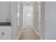 Hallway with wood floors and built-in counter space, provides an organized entry into the home at 3034 Voyager Ave, St Cloud, FL 34771