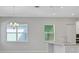View of a kitchen area showcasing light fixtures and a breakfast bar overlooking backyard at 3034 Voyager Ave, St Cloud, FL 34771
