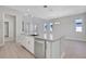 Modern kitchen island with stainless steel dishwasher, sink, and ample counter space at 3034 Voyager Ave, St Cloud, FL 34771