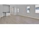 Bright living room features wood floors and a convenient built-in bar area for entertaining at 3034 Voyager Ave, St Cloud, FL 34771
