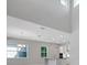 Spacious living room with high ceilings, modern fixtures, and an open kitchen concept at 3034 Voyager Ave, St Cloud, FL 34771