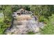 A partially built home with a garage, surrounded by a forest at 30551 Saffron Ave, Eustis, FL 32736