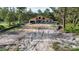 Unfinished home exterior featuring a modern design and block construction surrounded by a natural landscape at 30551 Saffron Ave, Eustis, FL 32736