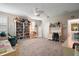 Large bedroom with ample shelving, an adjacent desk, and a cozy reading chair at 31857 Dahlia Ct, Eustis, FL 32736