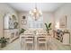 Bright dining room with a chandelier, shutters, and stylish decor at 31857 Dahlia Ct, Eustis, FL 32736