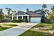 Beautiful two-story home featuring a 2-car garage, concrete driveway, and lush green lawn at 31857 Dahlia Ct, Eustis, FL 32736