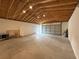 Spacious garage with concrete floor and wooden ceiling, perfect for storage or workshop at 31857 Dahlia Ct, Eustis, FL 32736
