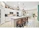 Bright, spacious kitchen features white cabinets, a large island, and modern stainless steel appliances at 31857 Dahlia Ct, Eustis, FL 32736