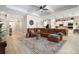 Inviting living room flows into the kitchen, showcasing an open concept living space at 31857 Dahlia Ct, Eustis, FL 32736