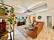 Spacious living room features neutral paint, tray ceilings and tile flooring at 31857 Dahlia Ct, Eustis, FL 32736