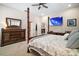 Spacious main bedroom with carpet, walk-in closet, and a mounted TV at 31857 Dahlia Ct, Eustis, FL 32736