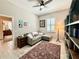 Comfortable office space featuring a corner sofa, a decorative rug, and natural light at 31857 Dahlia Ct, Eustis, FL 32736