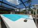 Refreshing screened pool area with outdoor lounging and backyard views at 31857 Dahlia Ct, Eustis, FL 32736