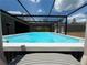 Relaxing screened-in pool with outdoor features and serene backyard views at 31857 Dahlia Ct, Eustis, FL 32736
