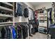 Spacious walk-in closet with custom shelving and ample hanging space for clothes and accessories at 31857 Dahlia Ct, Eustis, FL 32736