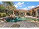 Inviting backyard pool and patio area perfect for entertaining and relaxation with lush landscaping and outdoor seating at 32543 Hawks Lake Ln, Sorrento, FL 32776