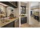 Wet bar area featuring granite countertops and a wine refrigerator for entertaining at 32543 Hawks Lake Ln, Sorrento, FL 32776