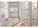 Bright bathroom featuring a soaking tub and glass enclosed shower promoting a relaxing experience at 32543 Hawks Lake Ln, Sorrento, FL 32776