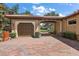 Paver driveway leads to porte-cochere, garage, and lovely courtyard at 32543 Hawks Lake Ln, Sorrento, FL 32776