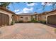 Beautiful home featuring circular paver driveway, porte-cochere, and mature landscaping at 32543 Hawks Lake Ln, Sorrento, FL 32776