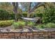 Secluded backyard features a hammock slung between mature trees, providing a tranquil outdoor retreat at 32543 Hawks Lake Ln, Sorrento, FL 32776