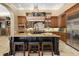Gourmet kitchen boasts custom cabinetry, a large island, and stainless steel appliances at 32543 Hawks Lake Ln, Sorrento, FL 32776
