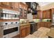 Well-equipped kitchen with stainless steel appliances and granite counters offers functionality at 32543 Hawks Lake Ln, Sorrento, FL 32776