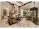 Bright living room featuring stone fireplace, travertine floors, coffered ceilings, and natural light at 32543 Hawks Lake Ln, Sorrento, FL 32776