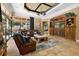 Cozy living room with a ceiling fan and access to the outdoors at 32543 Hawks Lake Ln, Sorrento, FL 32776